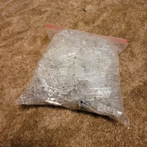 One bag of clear plastic clothes pins for clothes
